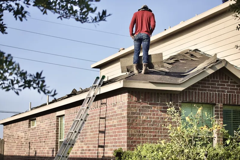 Professional roofer working on a residential roof in Accokeek Lawn